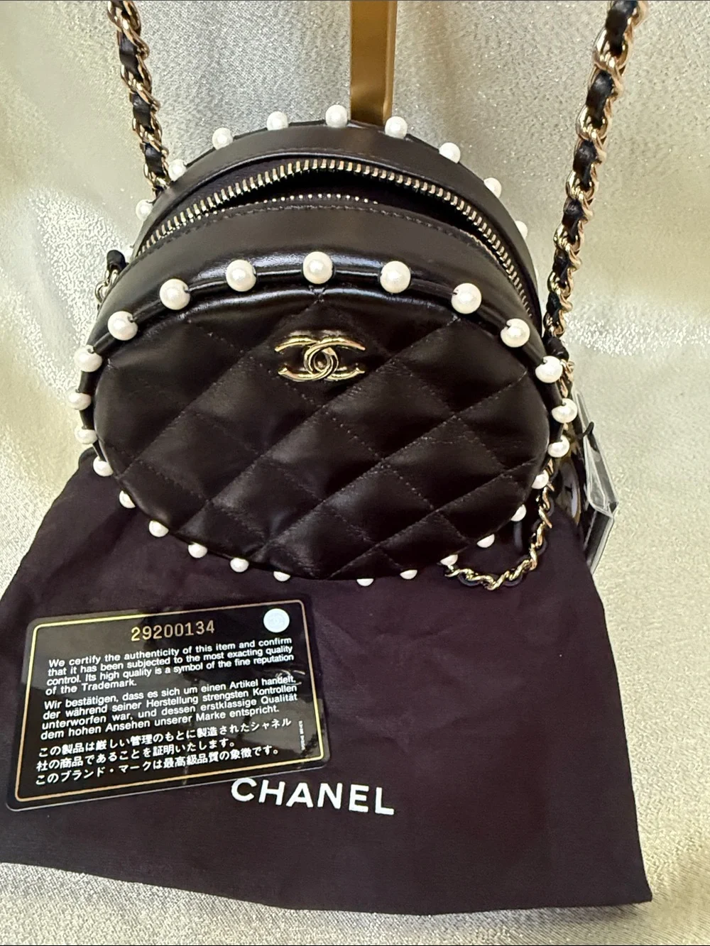 CHANEL Black Lambskin Quilted Round Crossbody with Pearl Trim with Chain